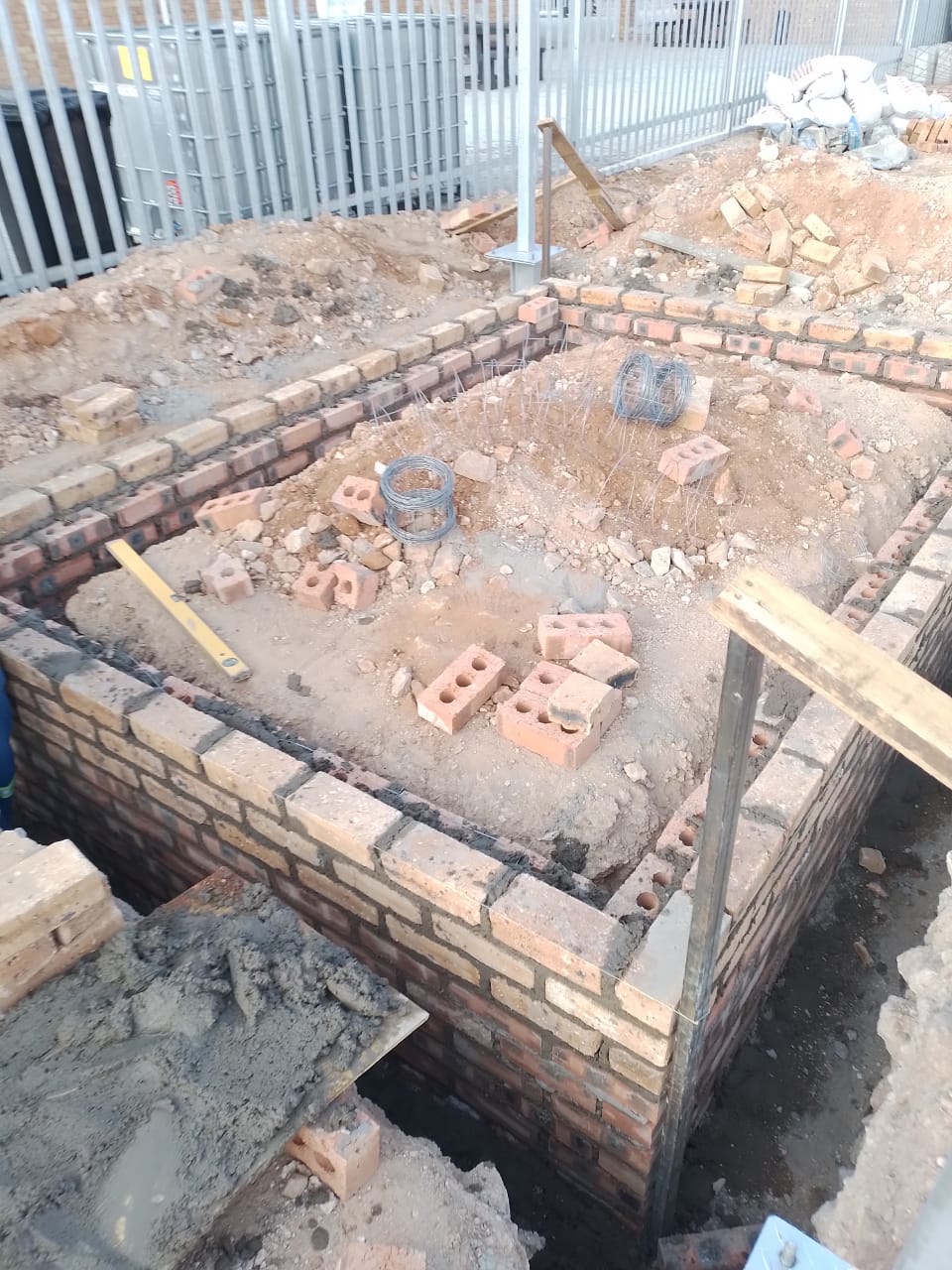 Bund wall mid-construction, wind farm — project photo