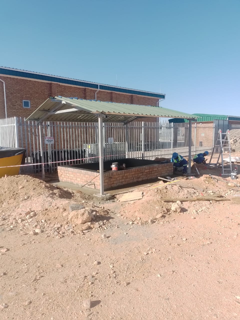 Bund wall mid-construction, wind farm — project photo